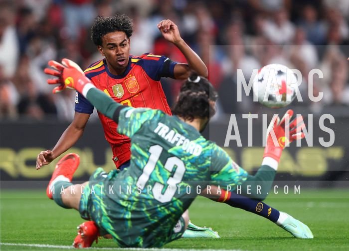 Lamine Yamal of Spain scores their first goal past James Trafford of England