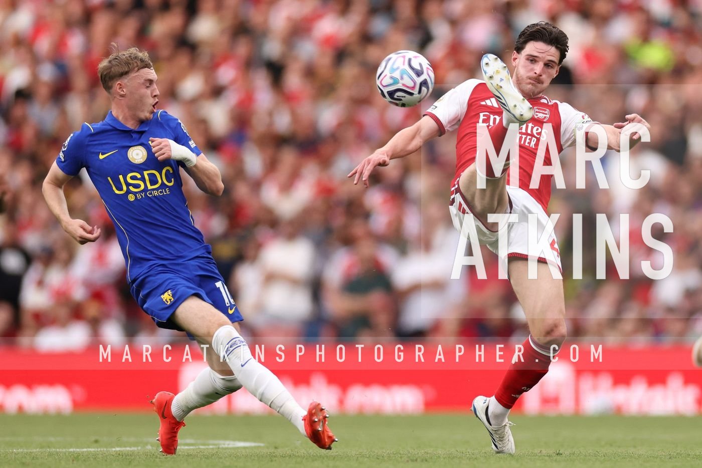 Declan Rice of Arsenal in action with Cole Palmer of Chelsea